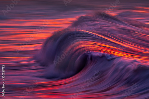 Photo of wave water textures at sunset with in camera panning technique
