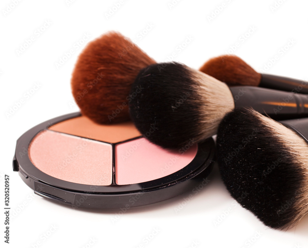 Make-up brushes and cosmetics isolated on a white background. Make-up brushes and cosmetics isolated on a white background.