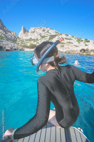Marseille, France - August 13th, 2019:People are swimming and diving in Calanques de Morgiou, Marseilles, Provence, South of France.  Everyone looks very cheerful and happy.