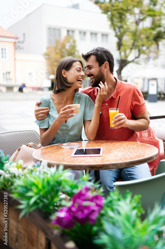 Cheerful young couple on a romantic date in a cafe. © NDABCREATIVITY