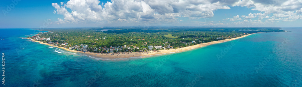 Aerial view of the popular beaches of Hikkaduwa and Thiranagama, the best places for surfing and swimming. Island Sri Lanka