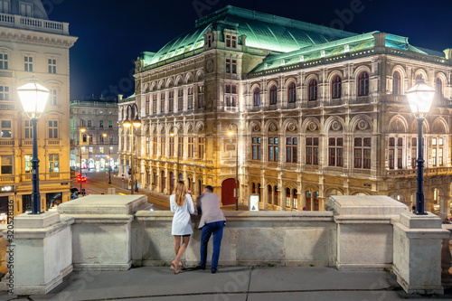 Photography couple on the balcony of albertina enjoy the view