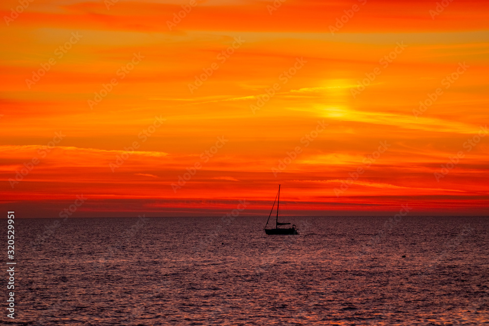 Seascape with a bright orange sunset