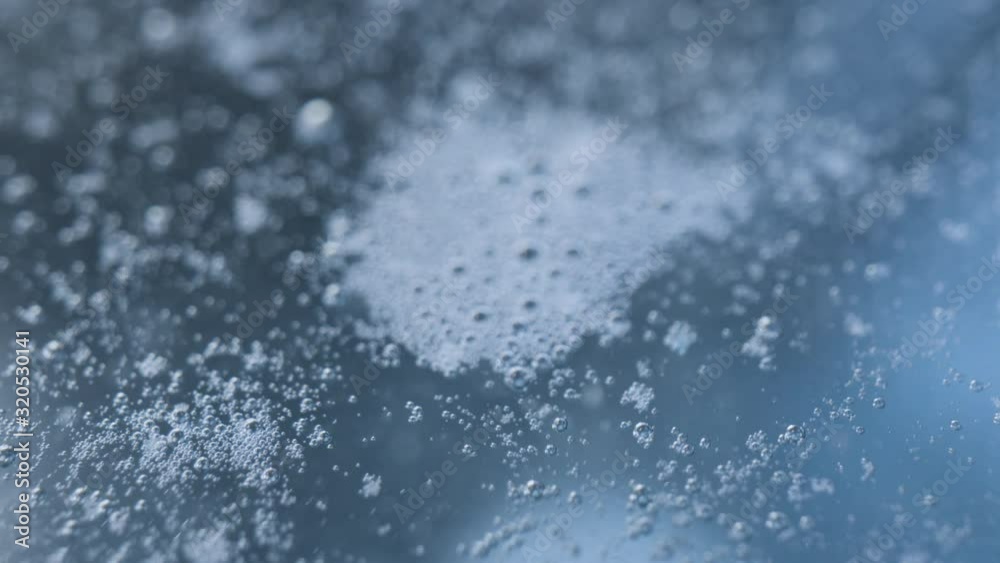 Macroshot of foam bubbles at water surface Macroshot of foam bubbles at water surface