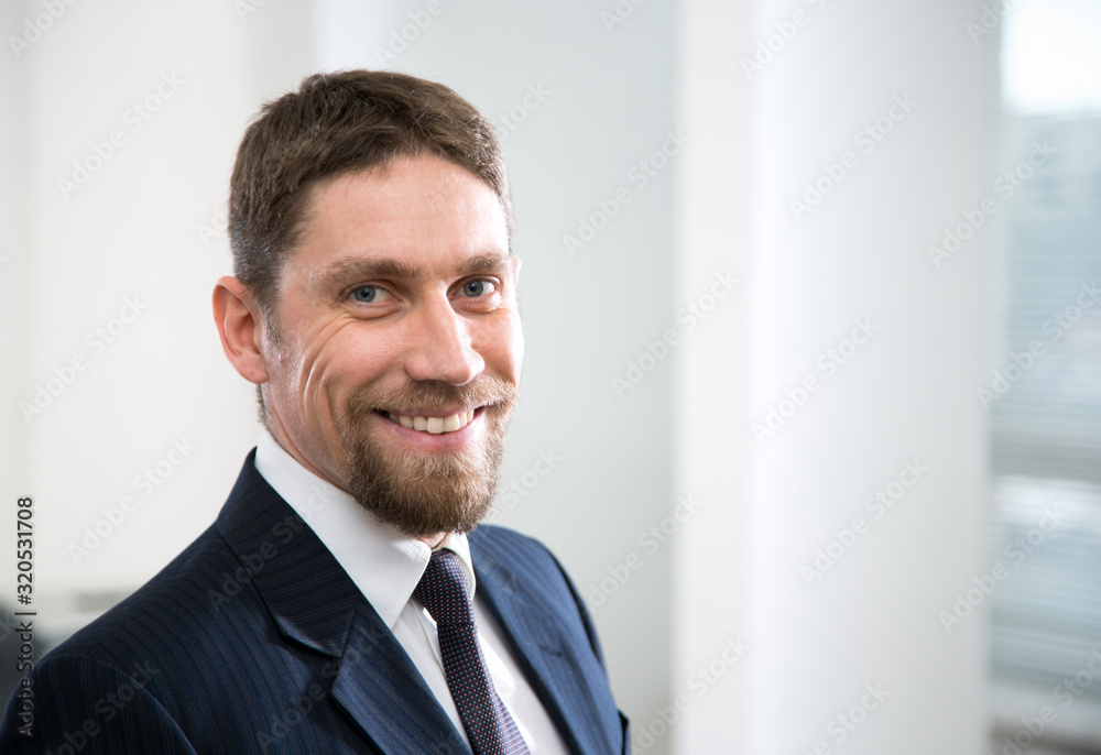 Young handsome businessman in a modern office Young handsome businessman in a modern office