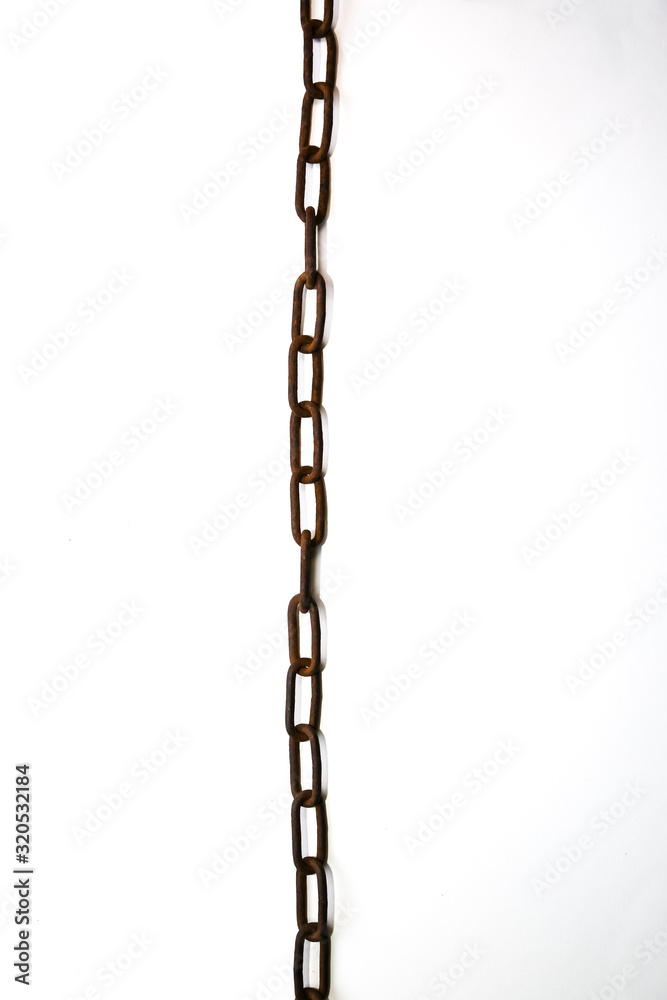 Rusty chains lying on the table.
