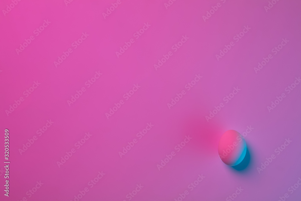Egg hunt is coming. Easter traditions, pink-blue colored eggs on pink background, neon light, top view, copyspace for ad. Concept of holidays, spring, celebrating, food and sweets, family time. Egg hunt is coming. Easter traditions, pink-blue colored eggs on pink background, neon light, top view, copyspace for ad. Concept of holidays, spring, celebrating, food and sweets, family time.