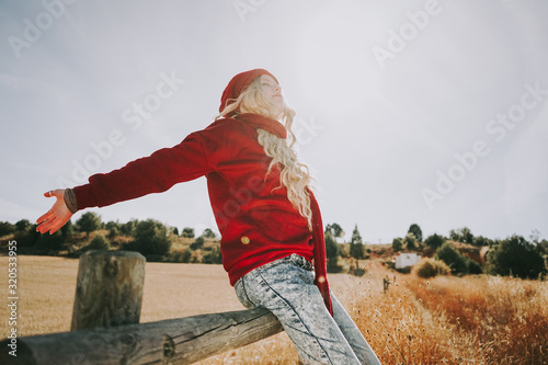 Happy young woman enjoying a sunny day