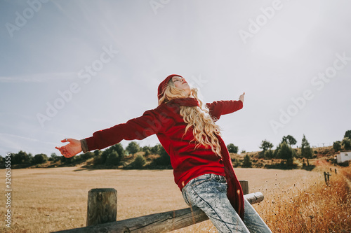 Happy young woman enjoying a sunny day