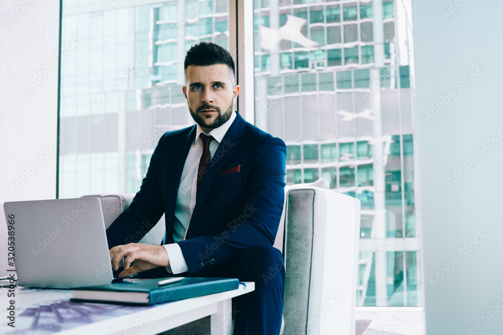 Classy executive male in suit working with laptop Classy executive male in suit working with laptop