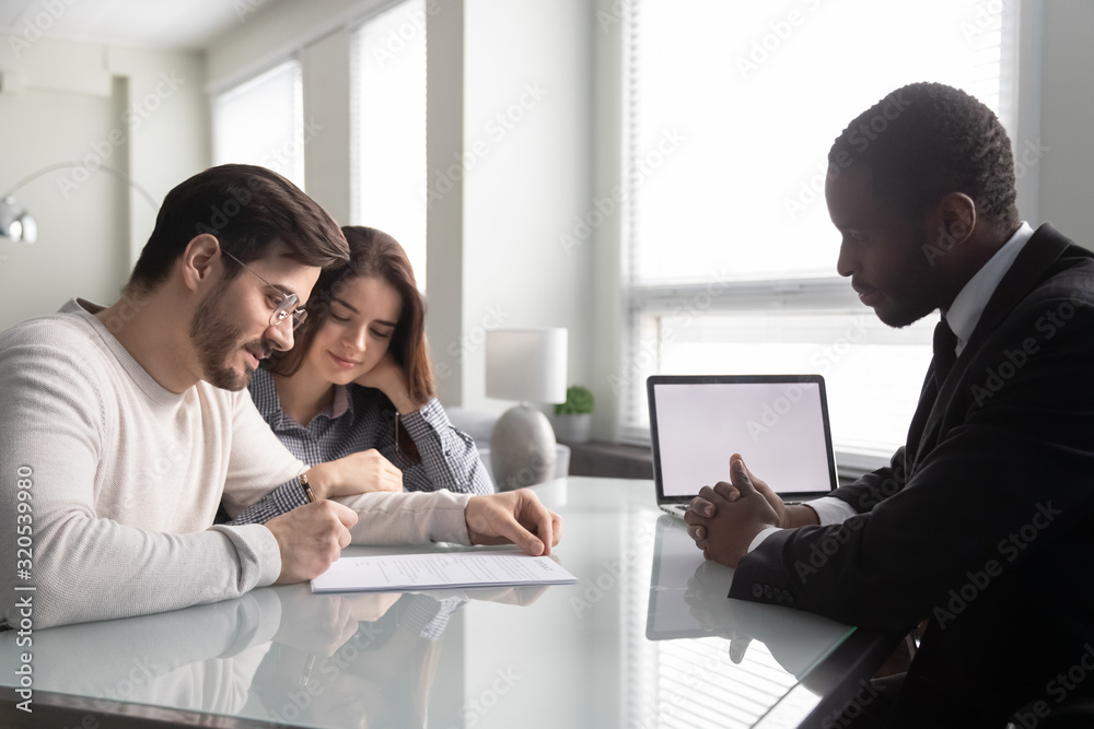 Fototapeta premium Husband puts signature on contract, family taking bank loan