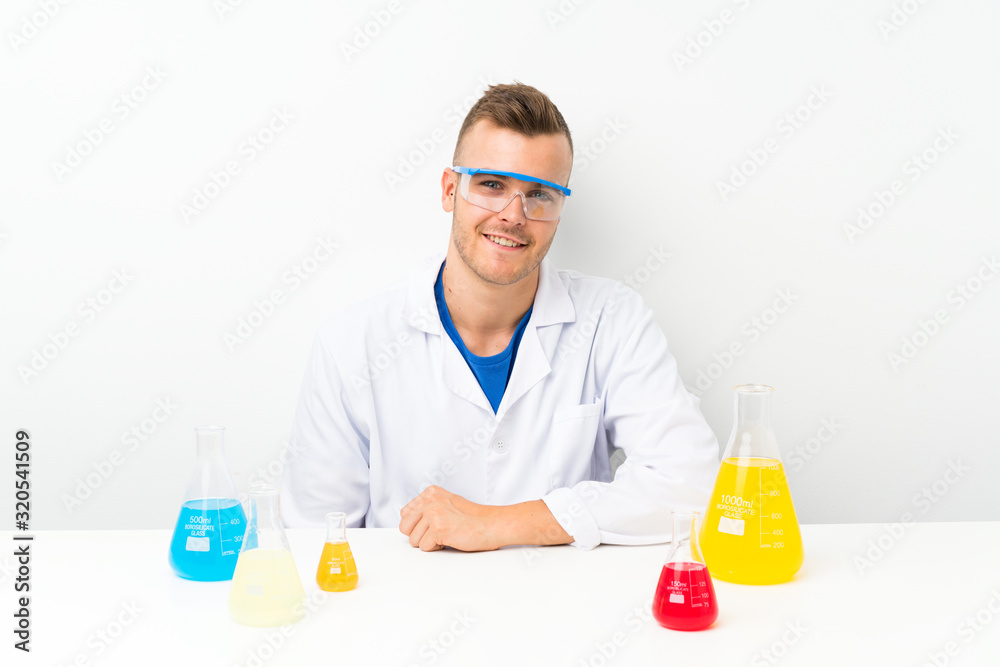 Young scientific with lots of laboratory flask Young scientific with lots of laboratory flask