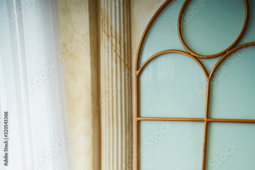 antique background  old wall and column  window with frosted glass
