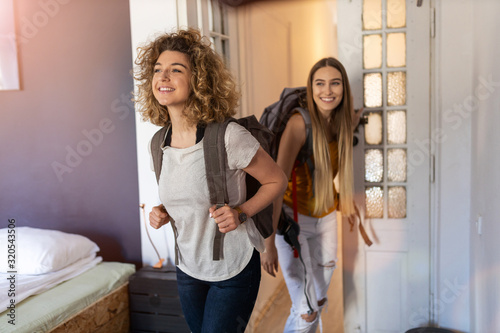 Young female tourists staying in youth hostel