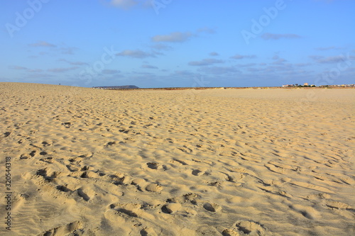 Natural background  a vast sandy beach with a clear horizon at sunset on Sal Island in Cape Verde  Cabo Verde