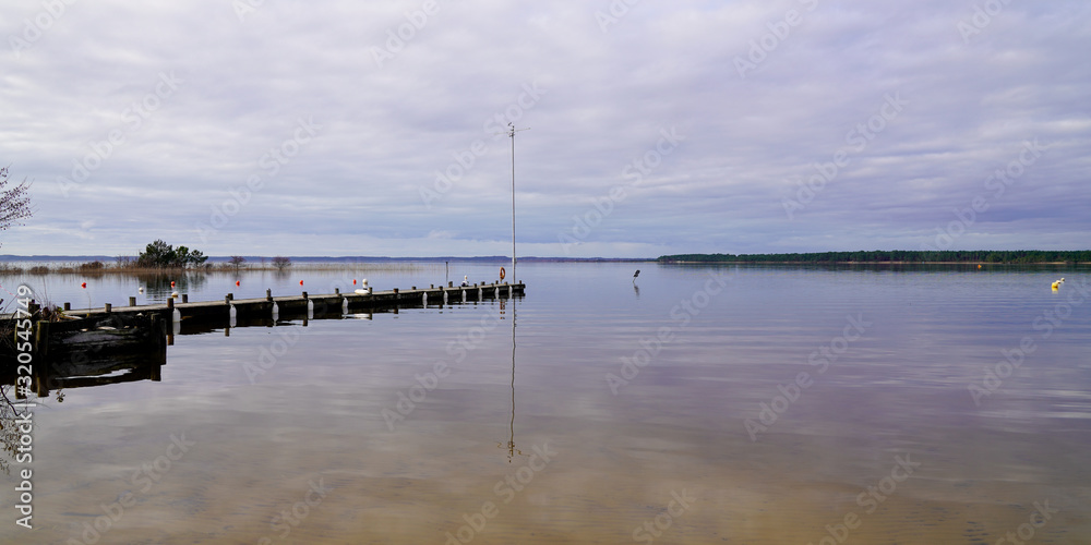 wood pontoon on lake of Cazaux Sanguinet on french Atlantic coast panorama in landes wood pontoon on lake of Cazaux Sanguinet on french Atlantic coast panorama in landes