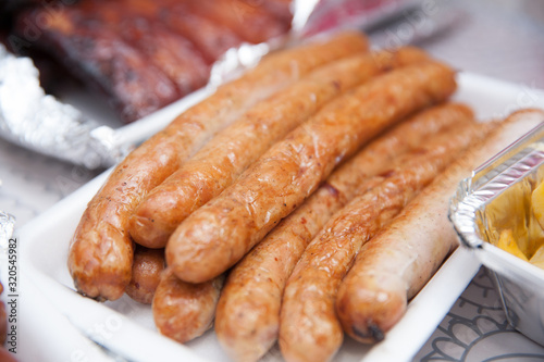Close up of homemade sausages baked in an oven on Oktoberfest