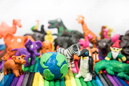 Animals made from Play Clay with Earth Planet in middle.