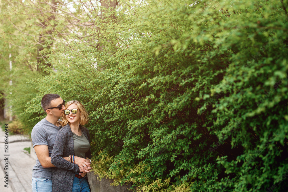 Couple walk around the city in spring