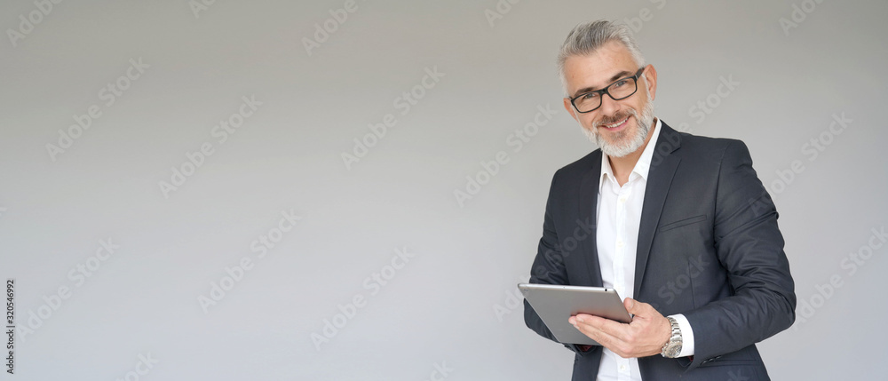 Businessman using digital tablet isolated on background- template - obrazy, fototapety, plakaty 