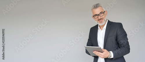 Businessman using digital tablet isolated on background- template