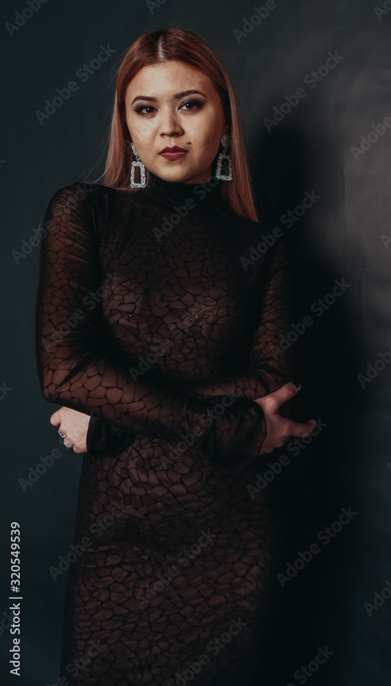 beautiful girl in black on a black background