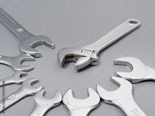 auto repair wrenches on a gray background