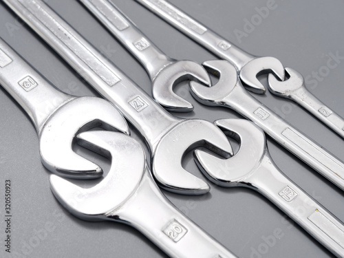 auto repair wrenches on a gray background