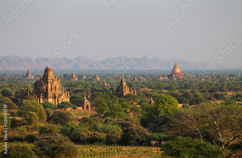 Sunrise over the valley with the ancient pagodas in Bagan