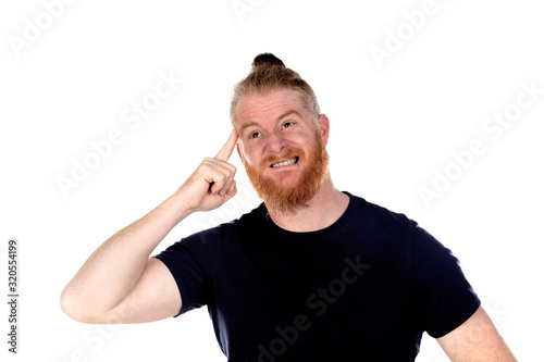 Red haired man with long beard thinking