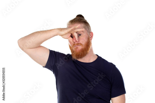 Red haired man with long beard covering his nose