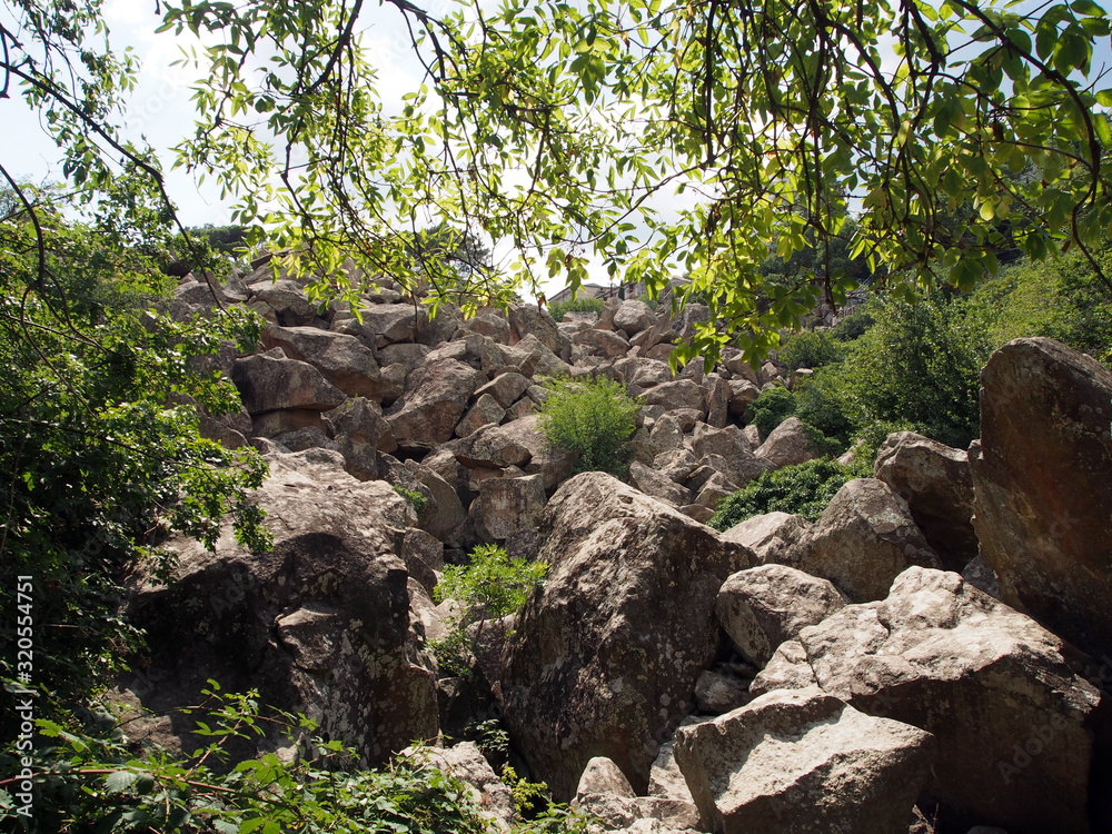 Stone chaos, a scattering of huge stones on the mountainside. The concept of the power of nature, an interesting tourist site.