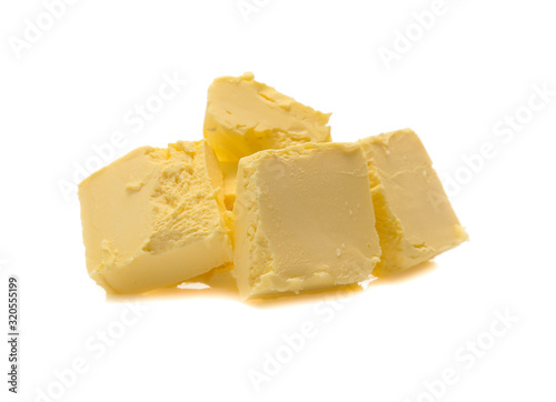 Pieces of butter isolated on white background