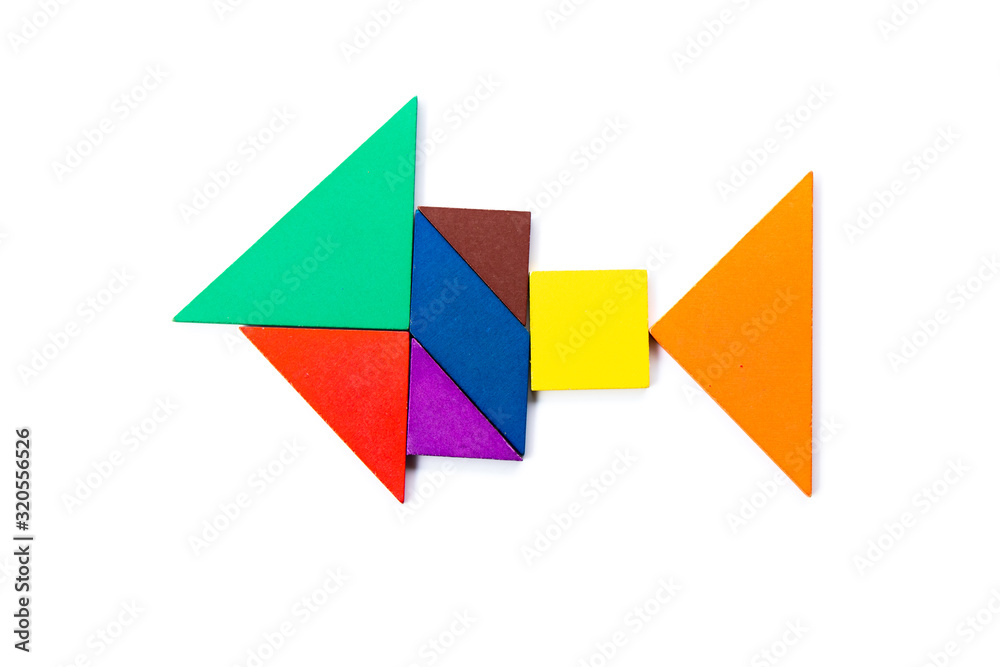 Color wood tangram puzzle in fish shape on white background Color wood tangram puzzle in fish shape on white background