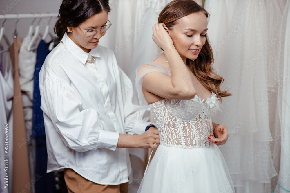 young caucasian woman dream to be bride, preparing for wedding in salon, taking measures