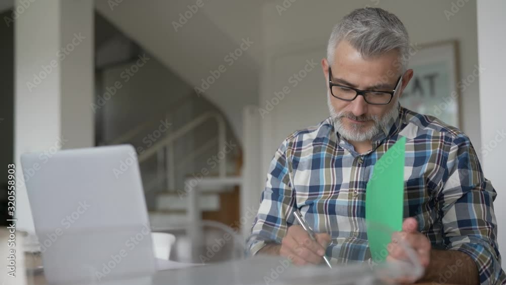 Man working from home on laptop computer