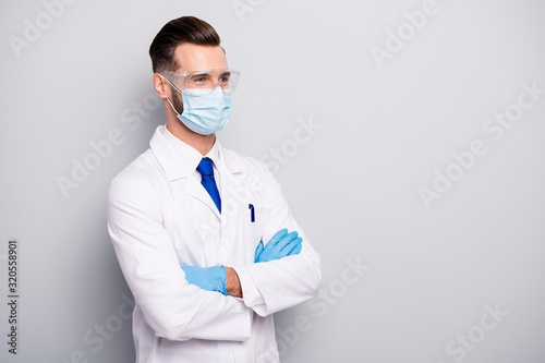 Profile side portrait of his he nice attractive cheerful experienced doc scientist dentist surgeon apothecary physicist folded arms isolated on light white gray pastel color background
