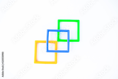 Three square shaped plastic with different color isolated on a white background.