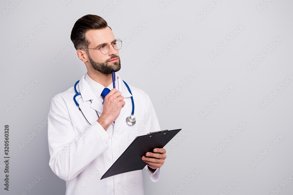 Profile side view portrait of nice attractive smart clever focused pensive bearded doc creating therapy strategy writing disease history document isolated on light white gray pastel color background Profile side view portrait of nice attractive smart clever focused pensive bearded doc creating therapy strategy writing disease history document isolated on light white gray pastel color background