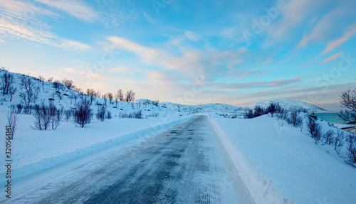 Beautiful winter landscape with snow and ice covered road - Tromso, Norway - Arctic landscape