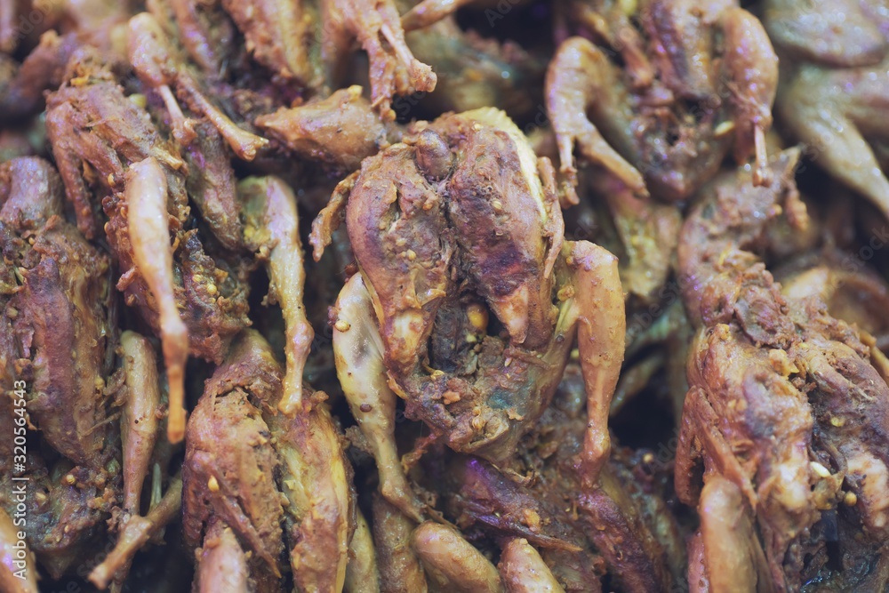 Close up of Fried quail, thai street food market Close up of Fried quail, thai street food market