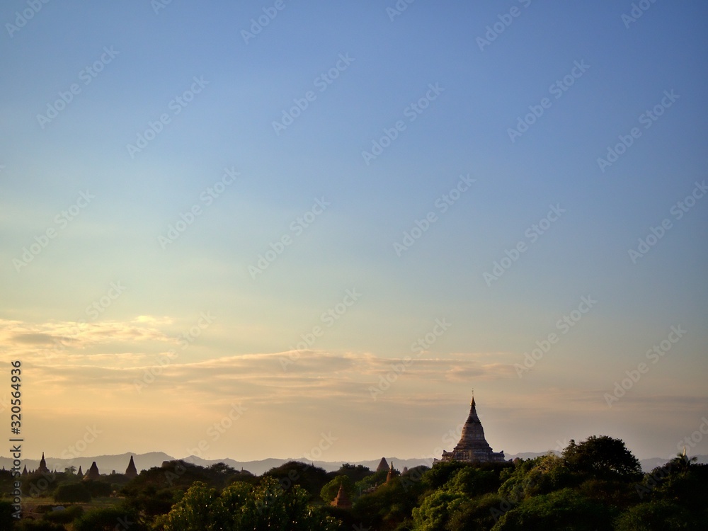 The evening landscape of Bagan, the World Heritage site of Myanmar with clear golden sky