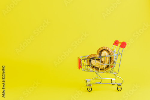 Shopping trolley with heart shaped cookies. copy cpace