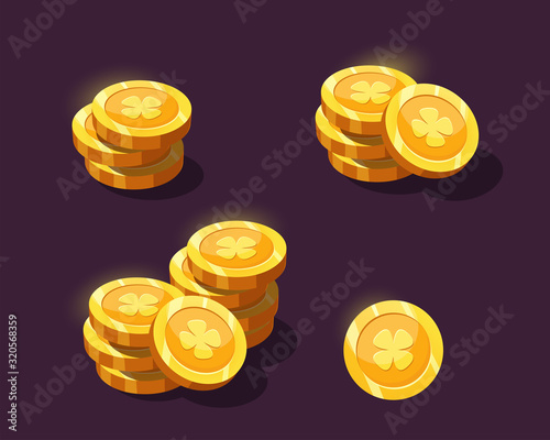 Coins for the game interface. Golden cartoon coins for game design, web, applications. Game coin with clover. 