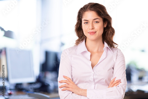Free Download Close-up portrait of young businesswoman in the office - GFXLoad
