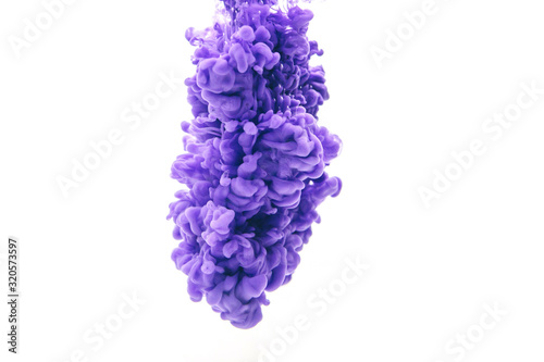 Abstract form purple color ink in water isolated on white background