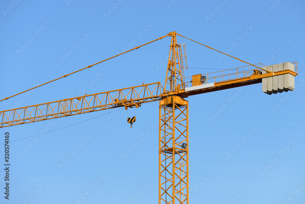 construction tower crane against the blue sky construction tower crane against the blue sky