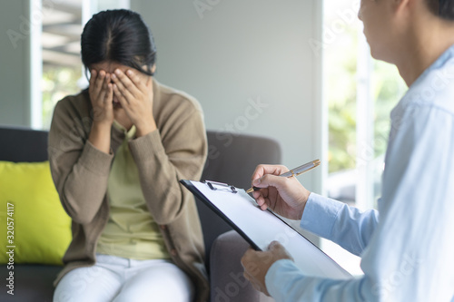 psychologist talking with depressed patient about mental condition.