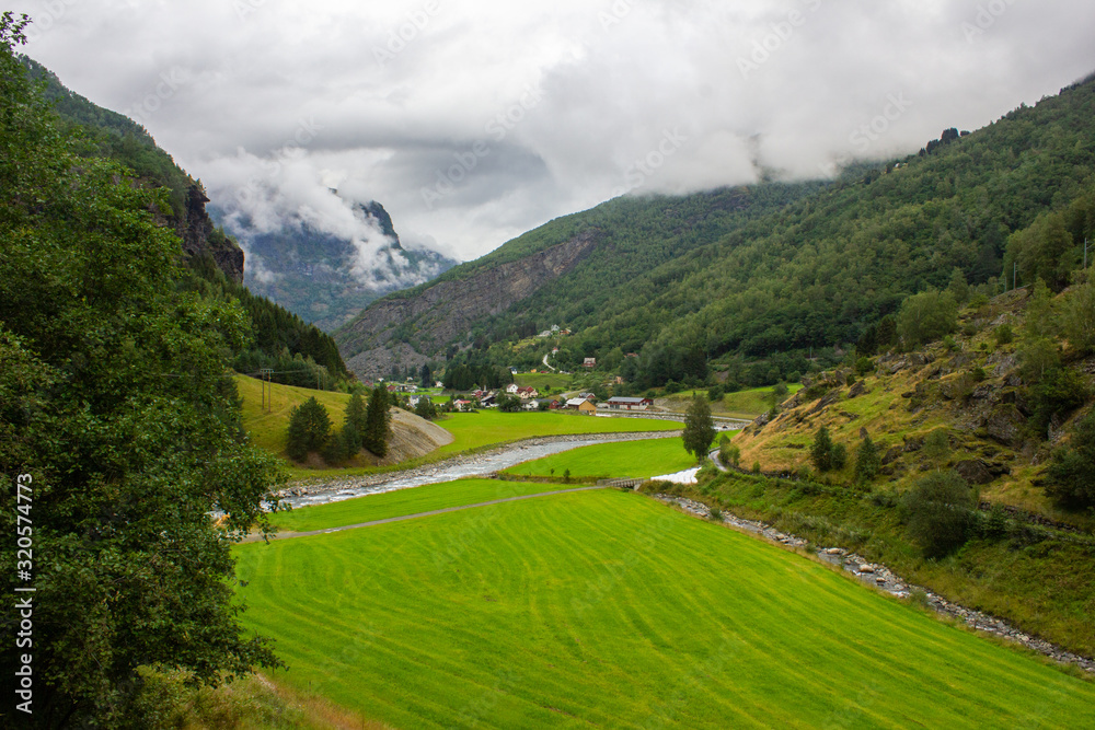 Green meadow in a mountain valley. Norway