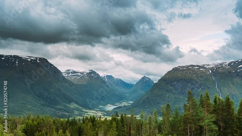 Byrkjelo Village, Sogn Og Fjordane County, Norway. Beautiful Sky Above Norwegian Rural Landscape. Bergheimsvatnet Lake In Summer Day. Agricultural And Weather Forecast Concept. Time-lapse 4k photo